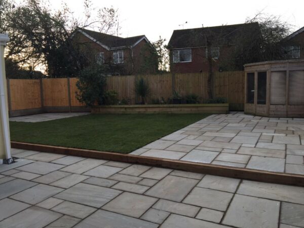 Indian sandstone patio with timber sleepers and turf in nuneaton (6)