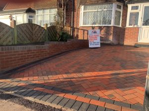 Brindle Block Paving Driveway with a Retaining Wall in Coventry