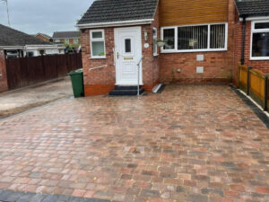 Driveway with Tumbled Tegula Paving in Rugby