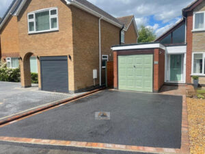 Tarmac Driveway with Tegula Paved Border and Pathway in Rugby