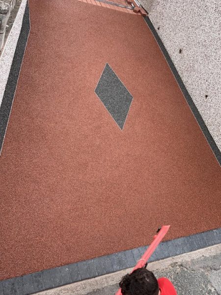 Our workers fitting resin on a driveway in Bodicote